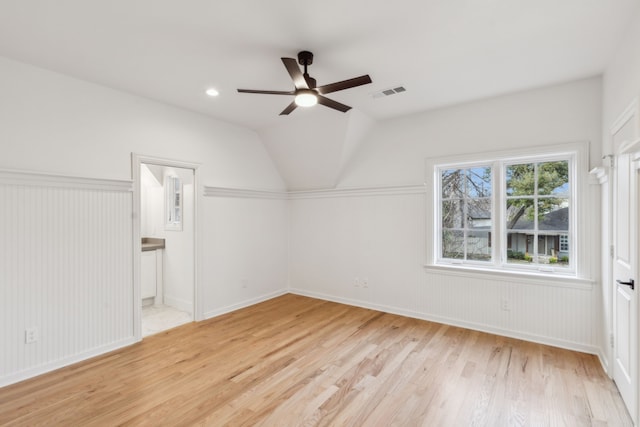 bonus room with ceiling fan, light hardwood / wood-style flooring, and vaulted ceiling