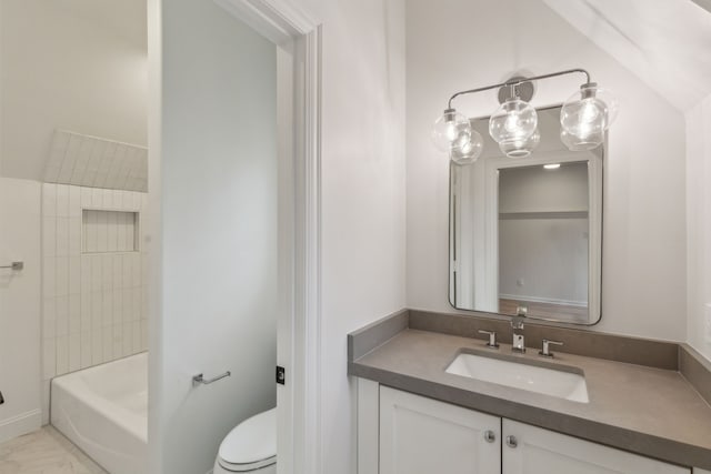 full bathroom with toilet, vanity, and tiled shower / bath