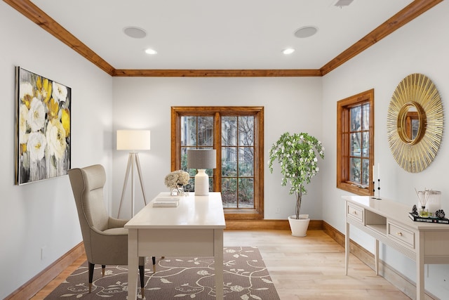 office featuring ornamental molding and light hardwood / wood-style floors