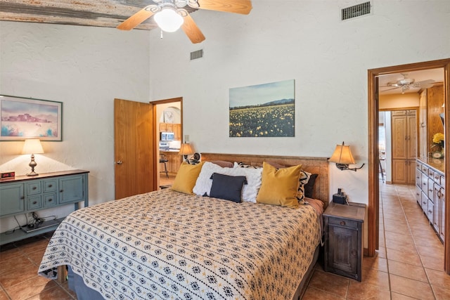 bedroom featuring ceiling fan and light tile patterned flooring