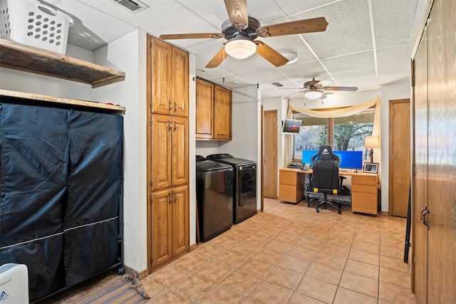 kitchen with light tile patterned floors, washer and clothes dryer, and ceiling fan