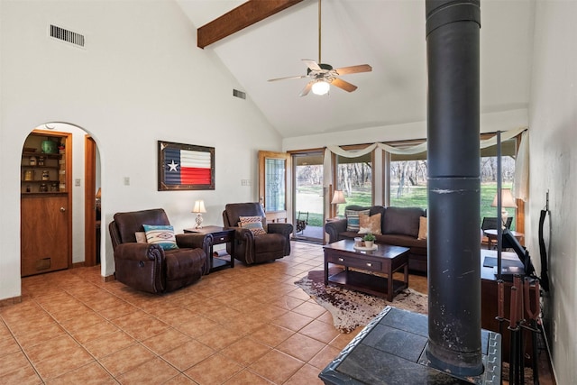 living room with ceiling fan, high vaulted ceiling, and light tile patterned floors