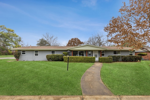 ranch-style home with a front lawn