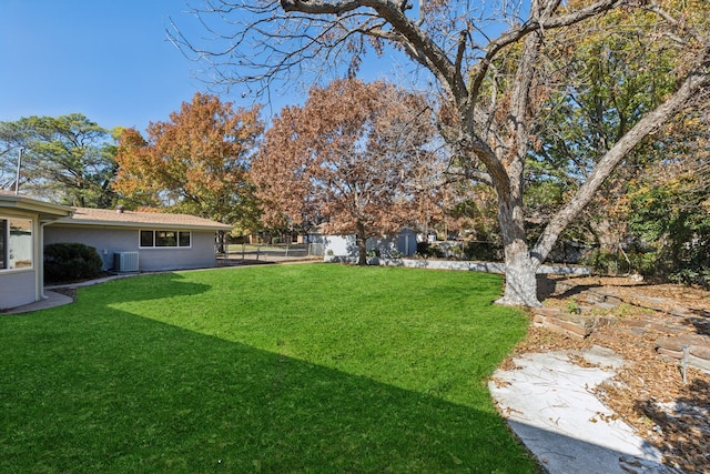 view of yard with central AC unit