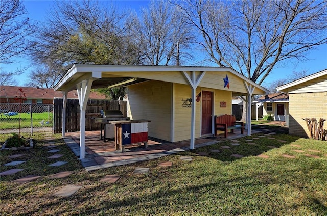 back of property featuring a yard