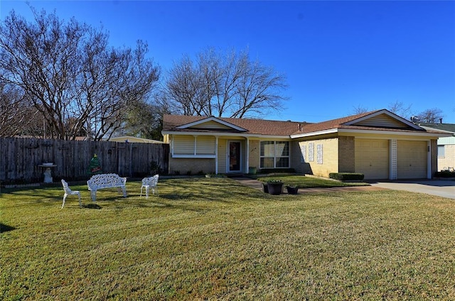 ranch-style house with a garage and a front yard