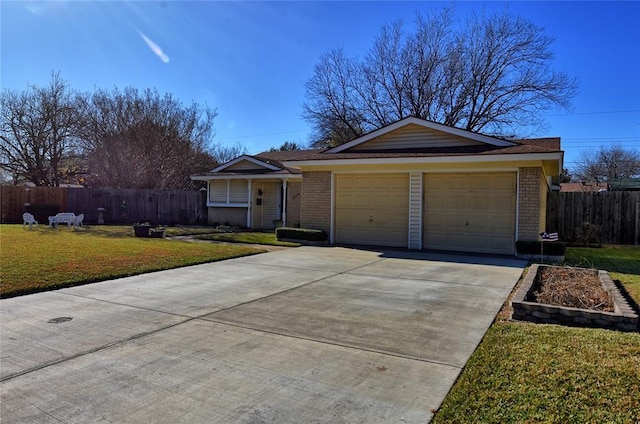 single story home with a garage and a front lawn