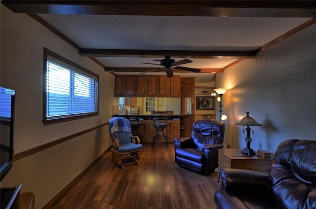 living room featuring hardwood / wood-style floors, ceiling fan, beam ceiling, and a textured ceiling