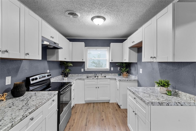 kitchen with a textured ceiling, sink, light hardwood / wood-style floors, white cabinetry, and stainless steel electric range