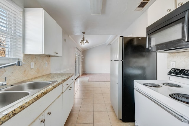 kitchen featuring electric stove, white cabinets, an inviting chandelier, and pendant lighting