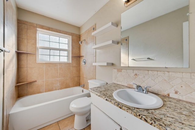 full bathroom featuring toilet, tiled shower / bath combo, tasteful backsplash, tile patterned flooring, and vanity