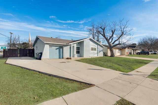 single story home featuring a front lawn and a garage