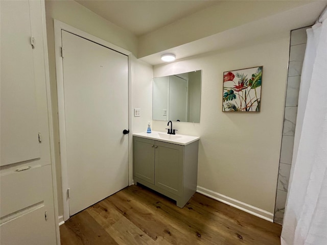 bathroom featuring hardwood / wood-style floors and vanity