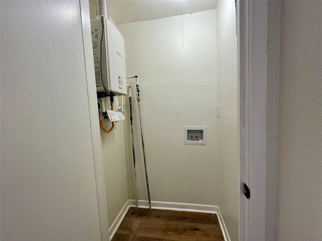 washroom featuring dark wood-type flooring and hookup for a washing machine