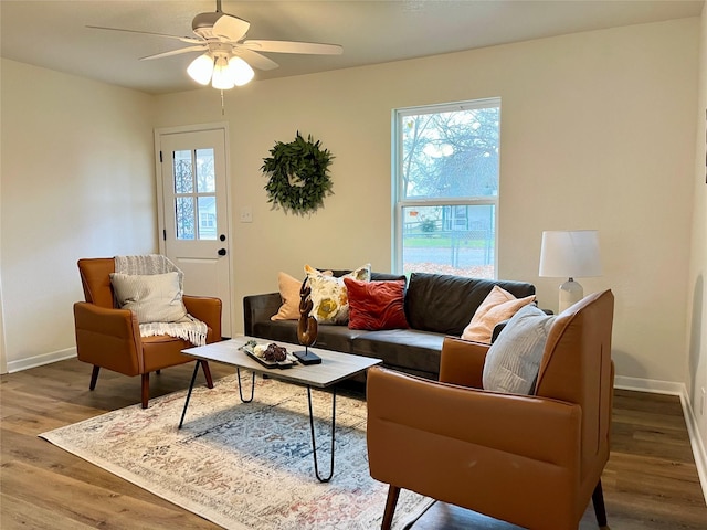 living room with hardwood / wood-style flooring and ceiling fan