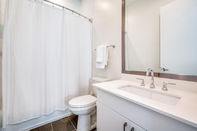 full bathroom featuring shower / bath combination with curtain, vanity, and toilet