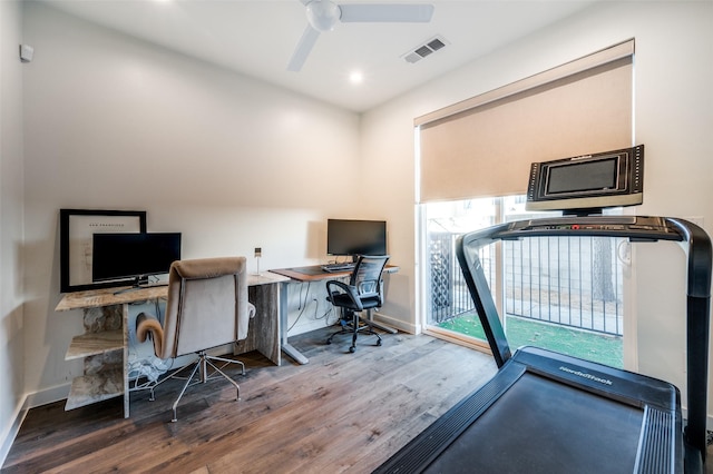 home office with hardwood / wood-style floors and ceiling fan