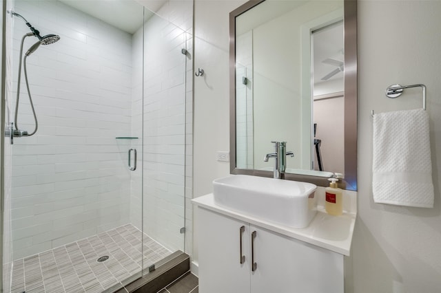 bathroom with vanity and a shower with shower door