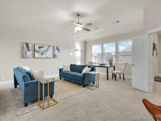 living room featuring ceiling fan and light colored carpet