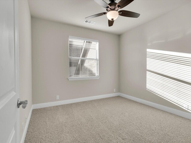 spare room with carpet flooring and ceiling fan