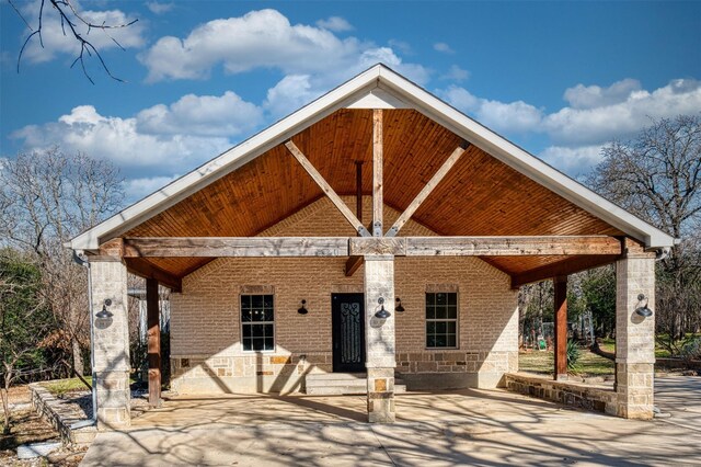 exterior space with a carport