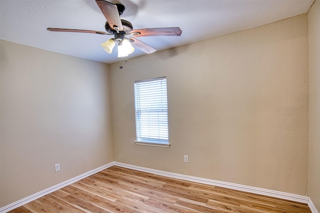 unfurnished room with ceiling fan and light hardwood / wood-style flooring