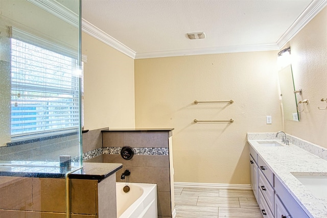 bathroom with a wealth of natural light, a bath, crown molding, and vanity