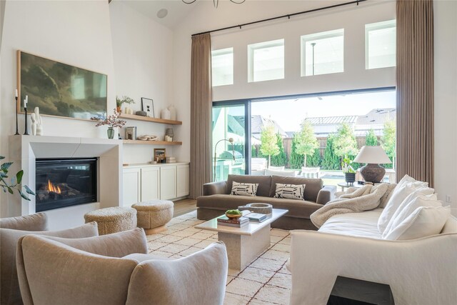 living room with vaulted ceiling and light hardwood / wood-style flooring