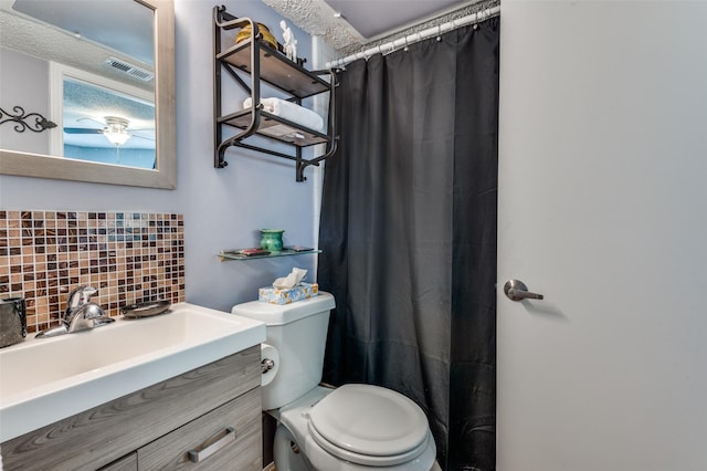 bathroom with toilet, walk in shower, vanity, and decorative backsplash