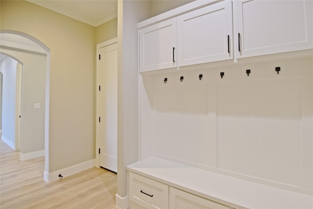 mudroom featuring light hardwood / wood-style floors and ornamental molding