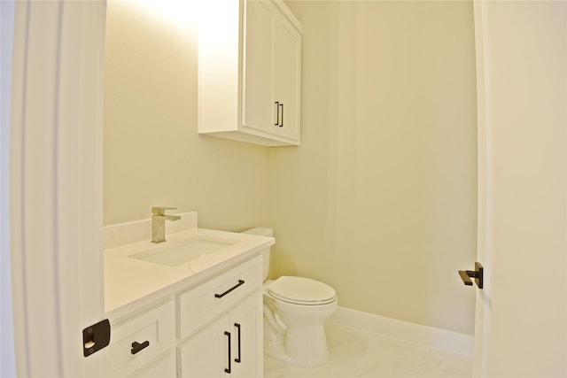 bathroom featuring tile patterned floors, vanity, and toilet