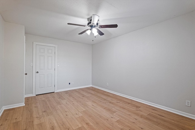 unfurnished room with light hardwood / wood-style flooring and ceiling fan