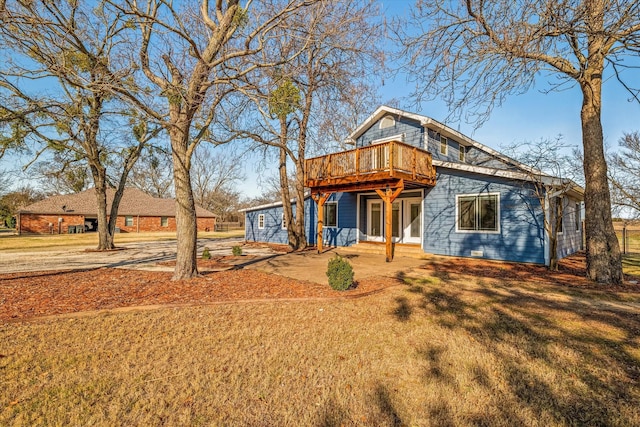 view of front of property featuring a patio and a deck