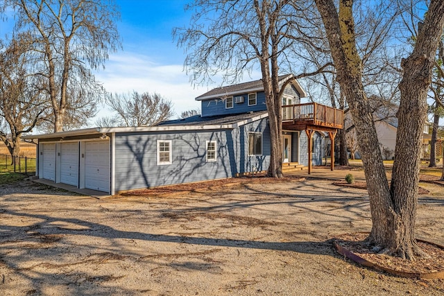 view of front of house featuring a garage and a deck