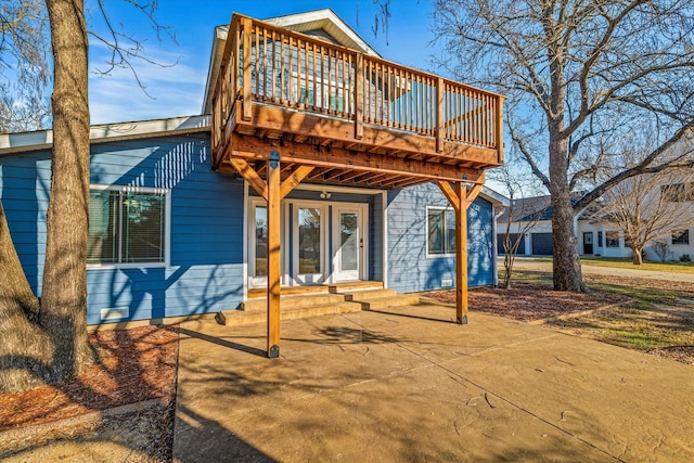 rear view of house with a patio