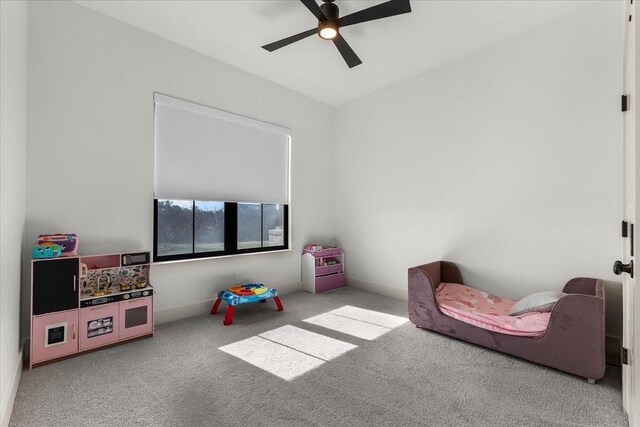 rec room featuring light carpet and ceiling fan