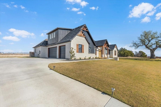 view of front facade with a front yard and a garage