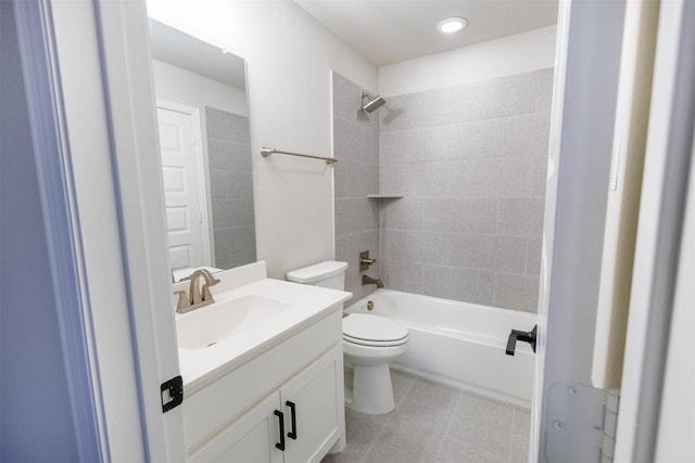 full bathroom with vanity, toilet, and tiled shower / bath