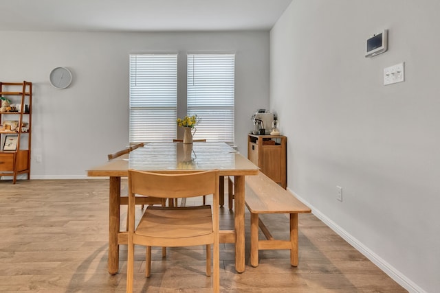 dining area with light wood-type flooring