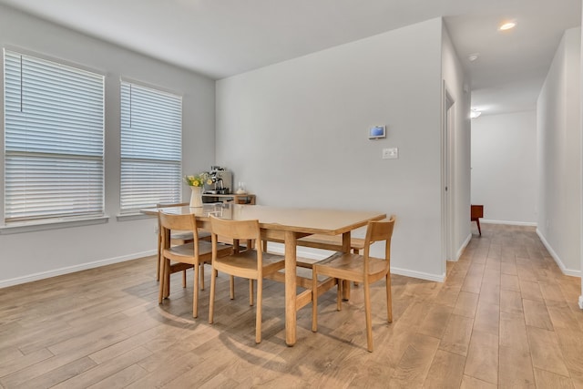 dining area with light wood-type flooring