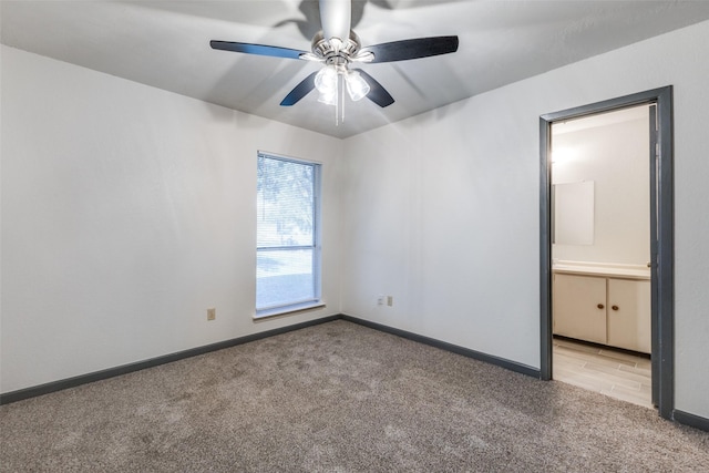 unfurnished room with light carpet and ceiling fan