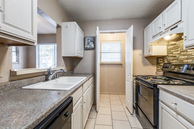 kitchen with black appliances, sink, light tile patterned floors, tasteful backsplash, and white cabinetry