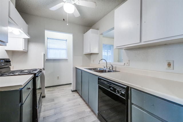 kitchen with a textured ceiling, ceiling fan, sink, black appliances, and white cabinets