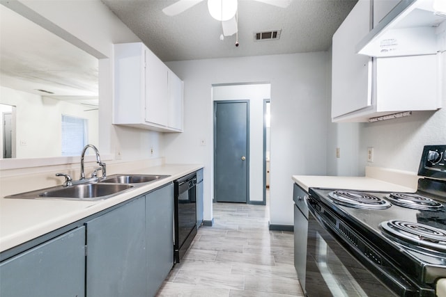 kitchen with sink, a textured ceiling, white cabinetry, and black appliances