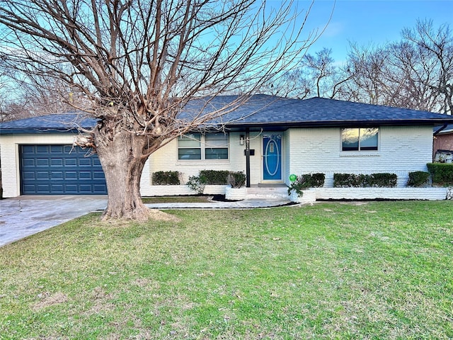 ranch-style house with a garage and a front yard