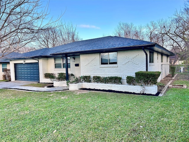 single story home with a garage and a front yard