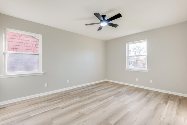 unfurnished room featuring ceiling fan and light wood-type flooring