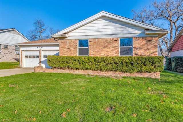 view of front property featuring a garage and a front lawn