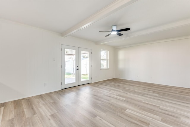 empty room with ceiling fan, beam ceiling, light hardwood / wood-style floors, and french doors