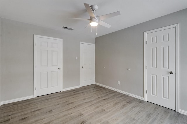 unfurnished bedroom featuring ceiling fan and light hardwood / wood-style flooring